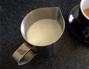 Pour milk into your stainless steel jug